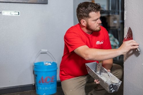 Handyman Repairing Drywall