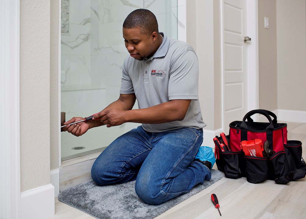 Handyman Repairing Shower Door