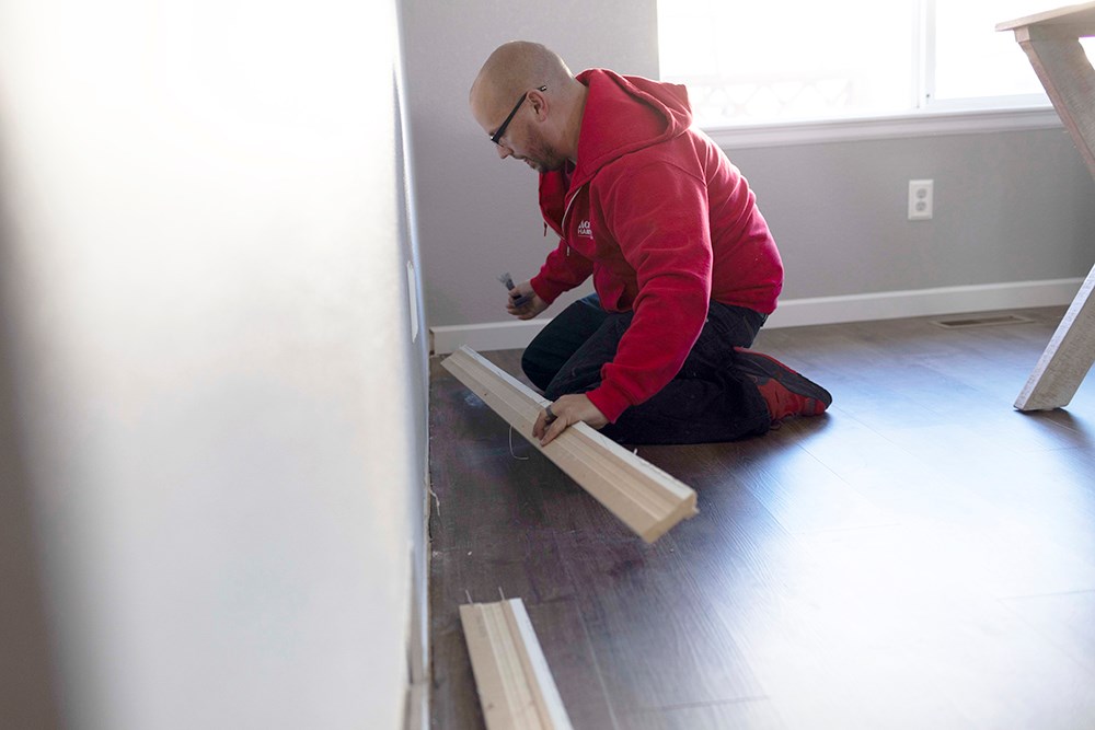 image of someone marking wood where it will be cut
