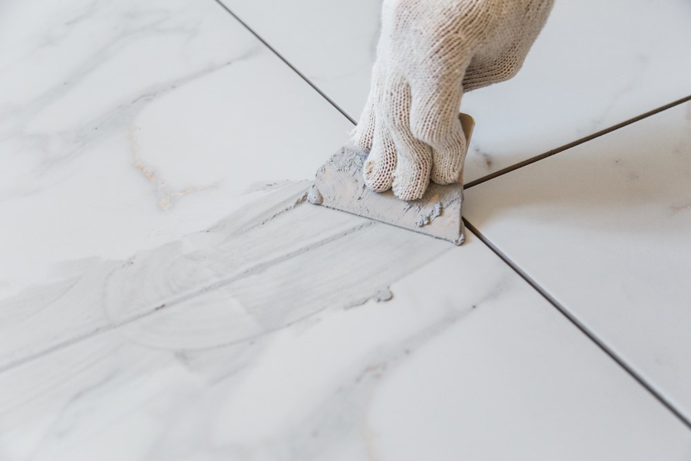 Handyman Repairing Floor Tile
