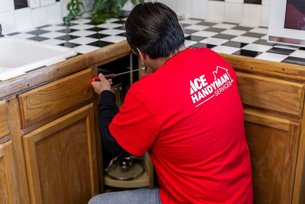 handyman repairing cabinets