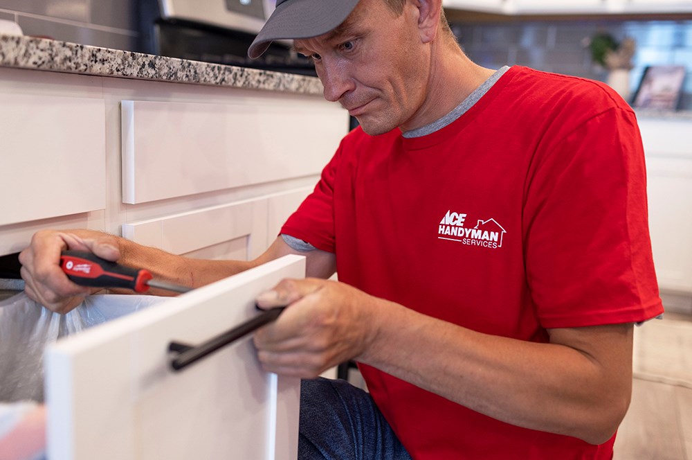 handyman replacing fixtures