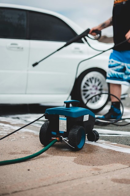 Skilled craftsman power washing a vinyl-sided home exterior in Lancaster, PA, removing built-up mildew stains near the foundation line. Skilled craftsman power washing a vinyl-sided home exterior in Lancaster, PA, removing built-up mildew stains near the foundation line.