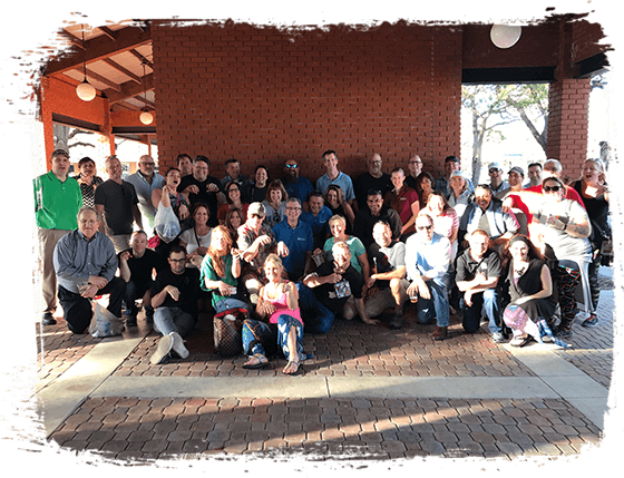 Image of about 30 people gathered for a group photo