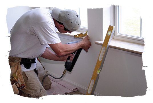 A handyman making household repairs.