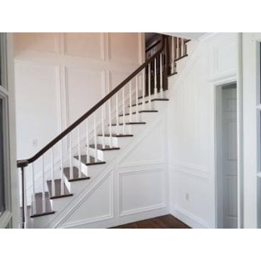 After #1 Custom carpentry moulding and trim added to two story staircase walls in Upper St. Clair PA