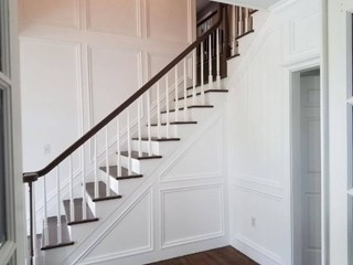 After #1 Custom carpentry moulding and trim added to two story staircase walls in Upper St. Clair PA