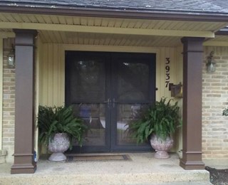 Exterior carpentry- front porch posts are replaced & repainted