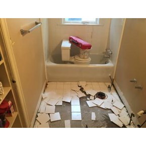 Tile floor demo. Call us when it's time to redo your bathroom!