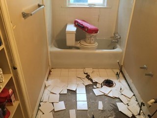 Tile floor demo. Call us when it's time to redo your bathroom!