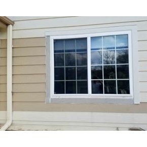 Before picture of siding replacement and window trim repair in Parker, CO