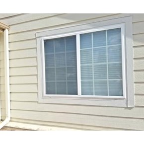 Before picture of siding replacement and window trim repair in Parker, CO