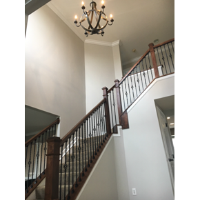 Ace Handyman Services remodeled staircase including new installing a new hand rail and iron spindles in Galena, Ohio