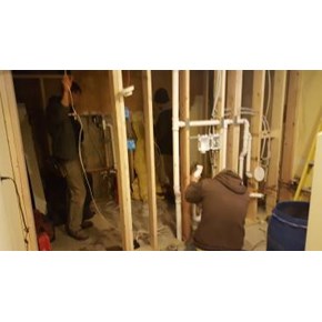 Installing plumbing and electrical in the dividing wall between the new bath and laundry