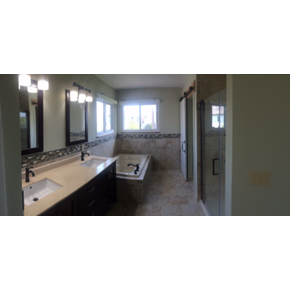 Bathroom Remodel in Westerville, Ohio featuring a double sink, soaker tub, and walk in shower with a barn door