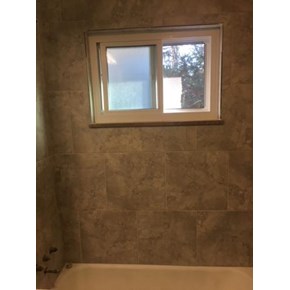 Tile work Handyman Matters completed in bathtub area (new tiled surround)
