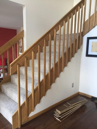 Minnetonka - golden oak railings and balusters, carpeted treads and risers