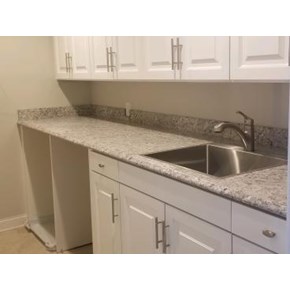 Luxuray Laundry with ample cabinets and folding area