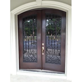 Refinished French front door with a fresh wood stain and restored grain for improved curb appeal.