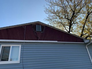 Ace Handyman Services Fox Valley Storm Damaged Siding - Gable Before