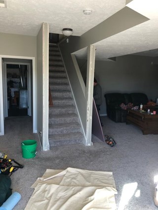 Before- Extended Hallway and installed door on basement stairs 
