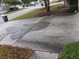 Pressure washed driveway before in North Myrtle Beach, SC