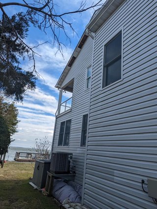 Damaged soffit before repair in Shady Side, Maryland