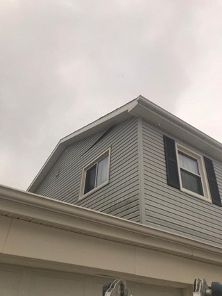 Before: Detached siding in Caledonia