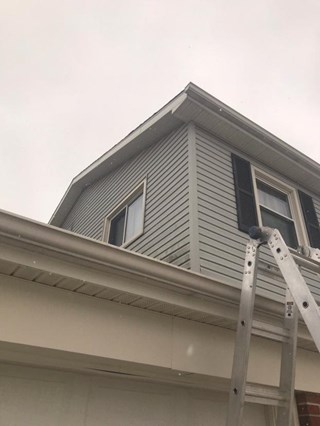 After: Siding re-attached in Caledonia