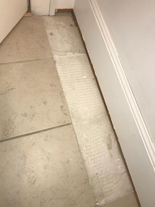 Before: Bathroom tile repair
