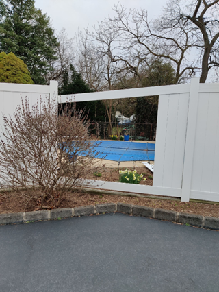Wind Damaged PVC Fence