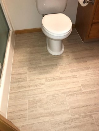 After:  Flooring & toilet replaced