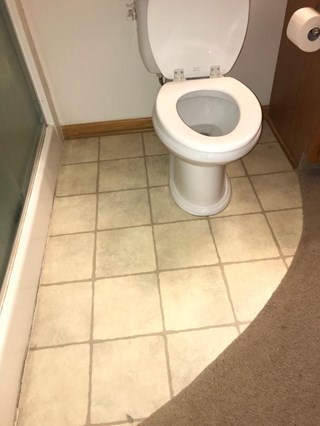 Before:  Flooring & toilet replaced