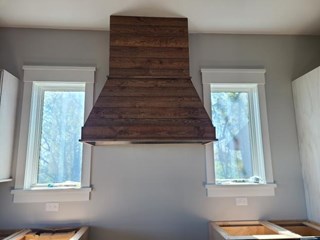 After our talented craftsman installed this fantastic range hood