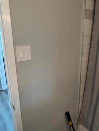 Wall Before we installed new towel rod in bathroom