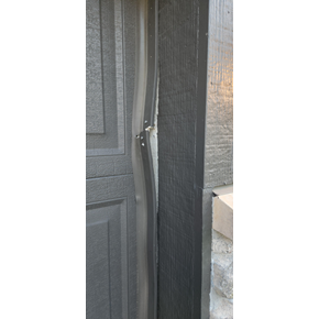 Vinyl Weather Trim on Garage Before