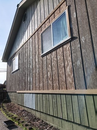 Before exterior painting after siding replacement in Eureka California