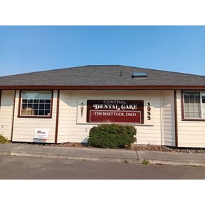 Central Dental business sign, hung by handymen in McKinleyville as part of a siding repair and exterior paint project, featuring Ace Handyman Services sign