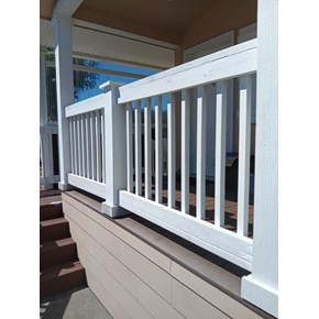 Exterior porch deck railing, carpentry performed by Ace Handyman Services, replacing the railing. Painted and stained white in Eureka