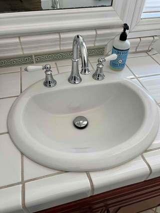 Porcelain sink with new faucet