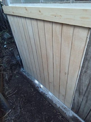 Repaired exterior wall siding fixed