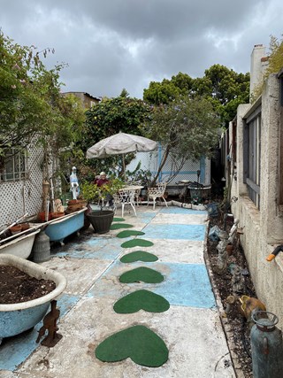 After clearing debris and materials in a backyard.  The backyard is now beautiful, usable and functional.