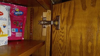 After broken cabinet door hinge repaired