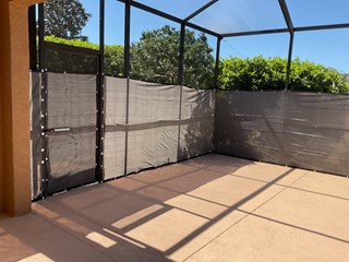 Lanai upgraded with a professionally installed privacy covering, creating a more private, comfortable outdoor space with improved style an functionality by Ace Handyman Services of Greater Land O'Lakes