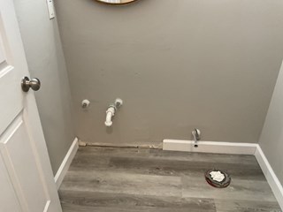 Bathroom before renovation, with the space prepared for new installations in New Port Richey.