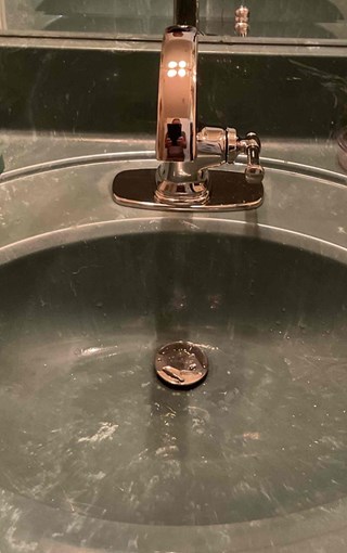 Newly installed modern faucet replacing the old fixture, providing improved performance and a clean updated look.