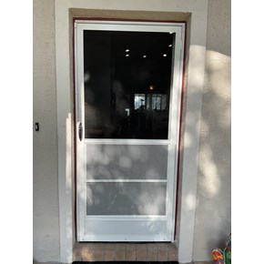 New front storm door professionally installed to improve home security, weather protection, and curb appeal.