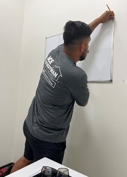 handyman hanging dry erase board handyman services in Rosemary Beach, FL