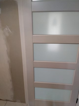 Ace Handyman Services Pilates Studio 5 panel door before photo in Port St. Lucie, FL