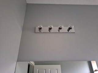 Ace Handyman bathroom light replacement before photo in Port St. Lucie, FL